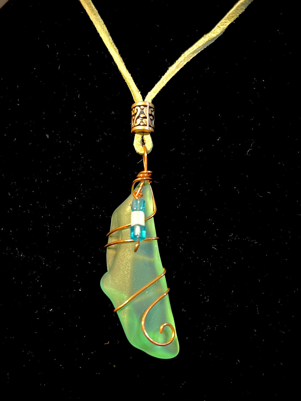 Light Green Sea Glass Pendant Wrapped In Copper Wire